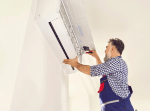 person conducting AC maintenance