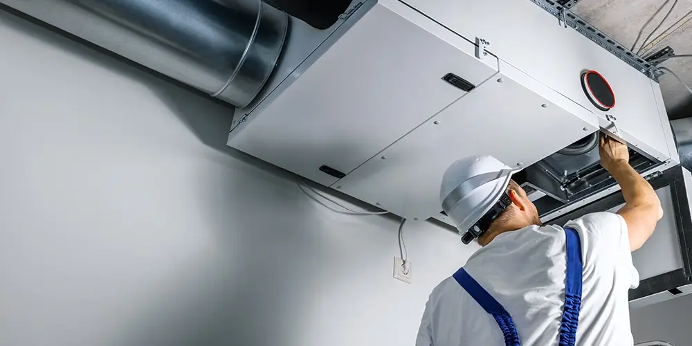an expert doing hvac installation