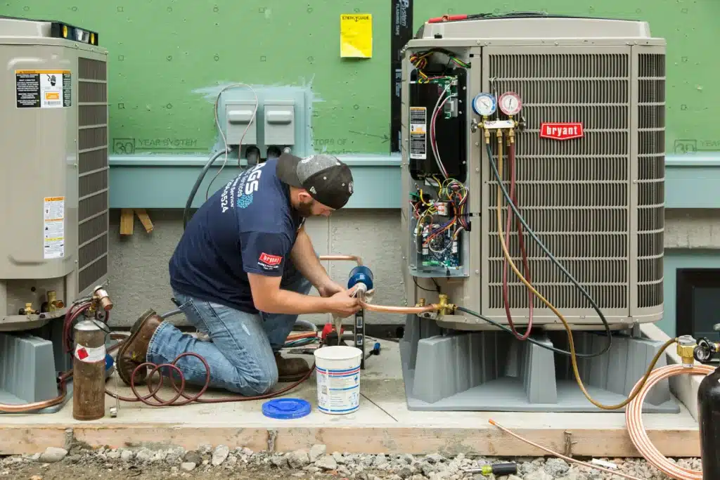 an expert doing hvac installation